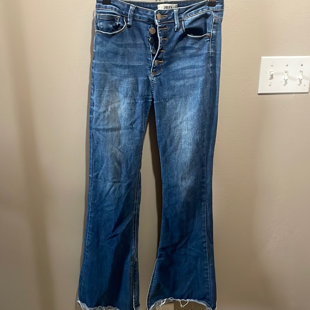 Flare jeans with multiple buttons